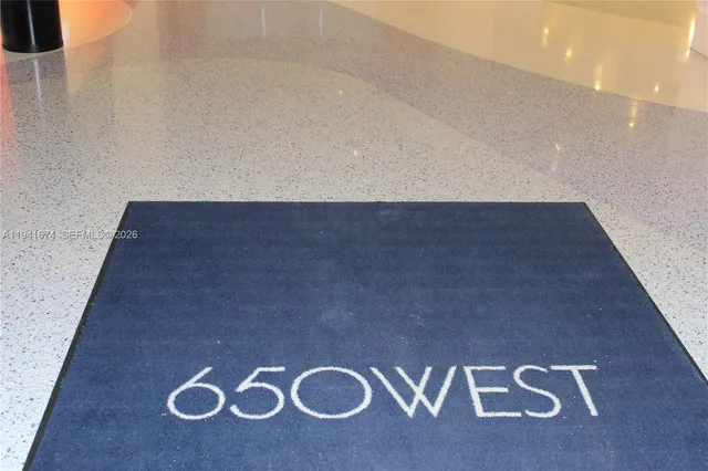 a picture of a bench in front of a window