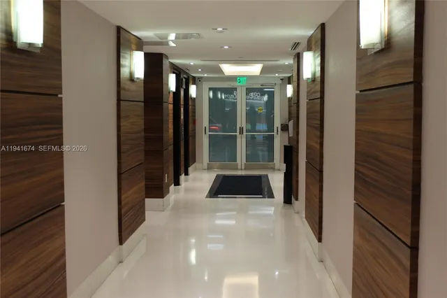 a bathroom with a glass door shower