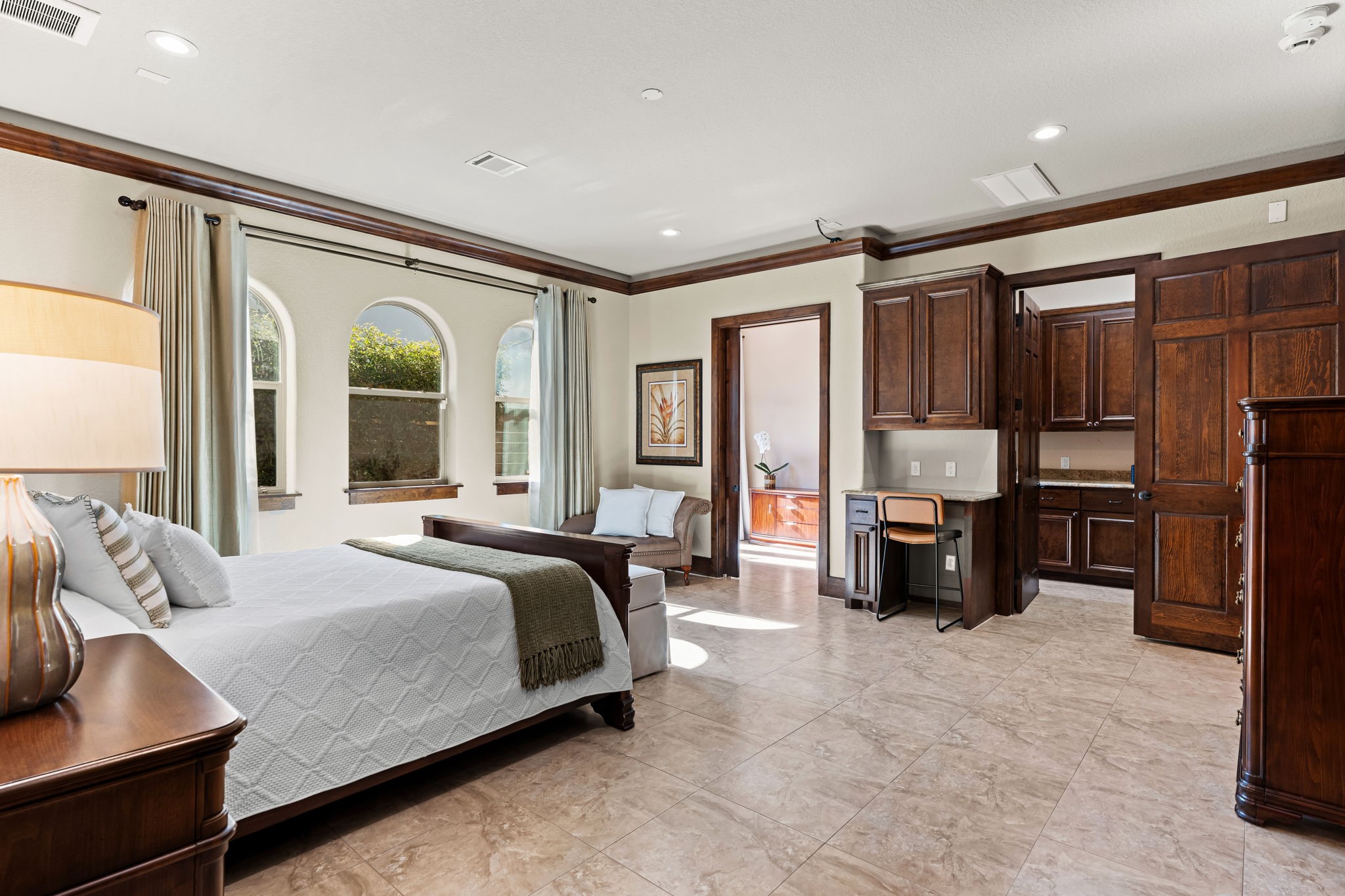 3751 Aberdeen Way Houston, TX 77025 - Photo 22 of 39 A versatile first-floor bedroom with its own private entrance, expansive footprint, and abundant natural light, ideal for use as a secondary primary suite, guest quarters, or private in-law retreat.