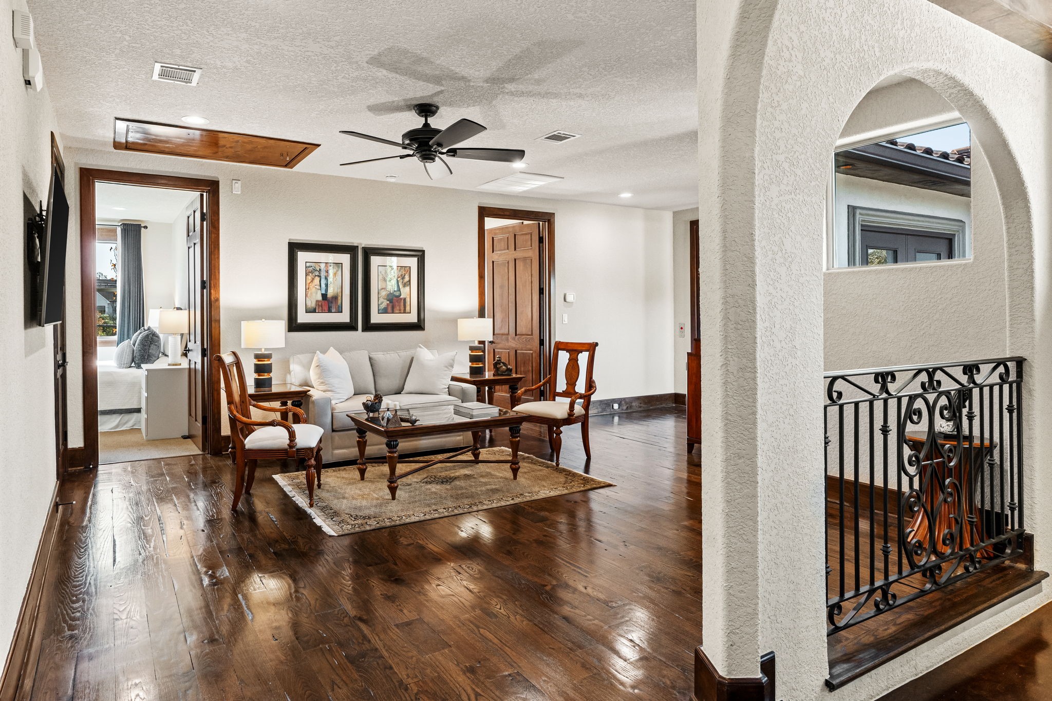 3751 Aberdeen Way Houston, TX 77025 - Photo 26 of 39 A cozy and inviting second-floor den with rich wood flooring, an open layout, and views overlooking the stairwell.