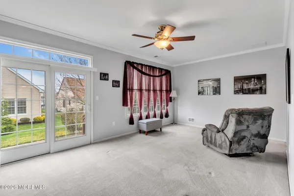 a bedroom with a bed dresser and a window