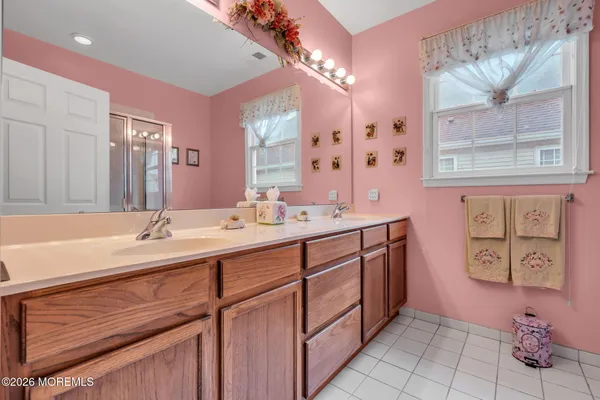 a bathroom with a sink toilet vanity and shower