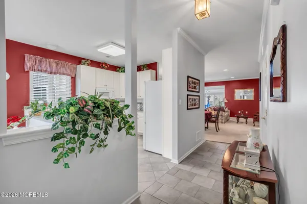 a kitchen with stainless steel appliances white cabinets and a stove a sink
