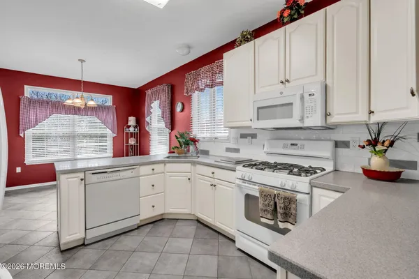 a white refrigerator freezer sitting inside of a kitchen