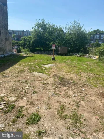 a swimming pool with trees in the background