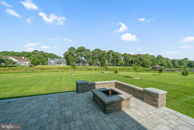 a view of a garden with lawn chairs