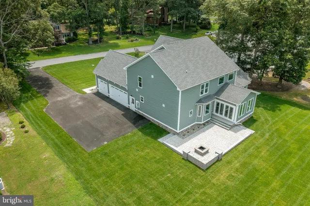 an aerial view of a house with a garden