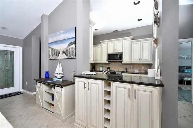 a kitchen with stainless steel appliances a stove top oven