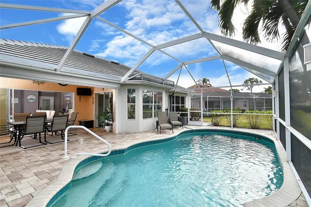 a view of a swimming pool with a patio