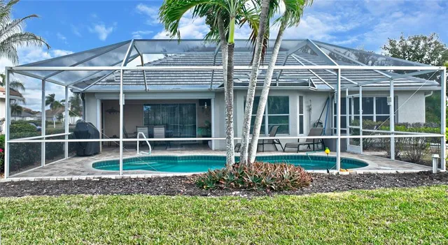 a view of a house with a yard and plants