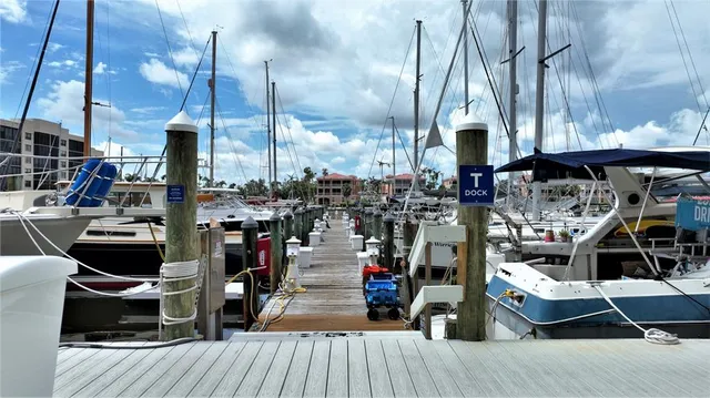 an aerial view of a residential houses with outdoor space and a lake view