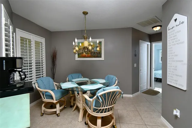 a dining room with furniture and window