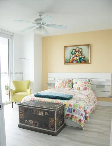 a bedroom with bed and window