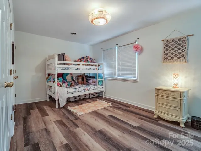 a room that has a bed and a chair in it