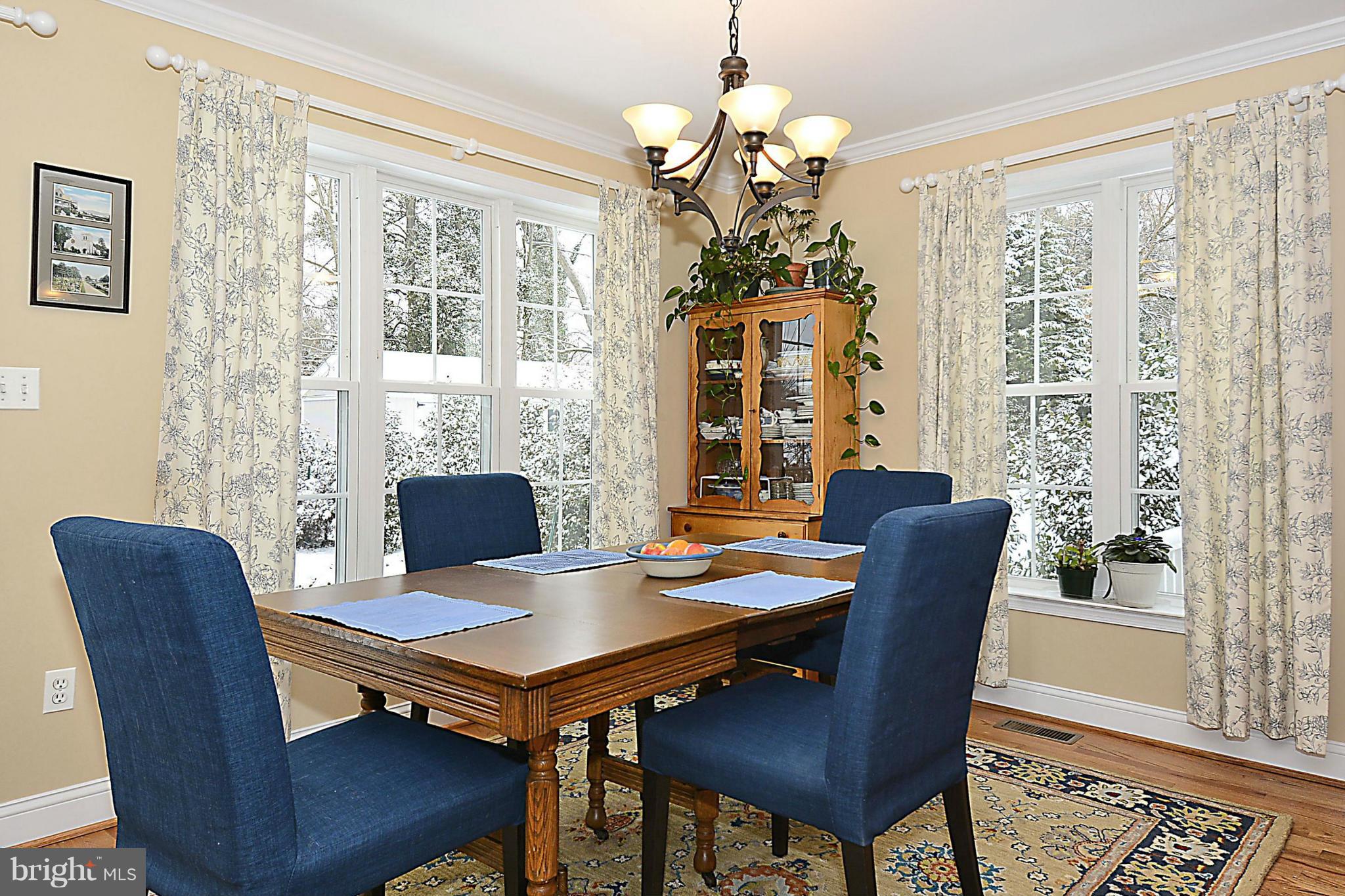 10504 Amherst Avenue Silver Spring, MD 20902 - Photo 14 of 30 a view of a dining room with furniture window and wooden floor