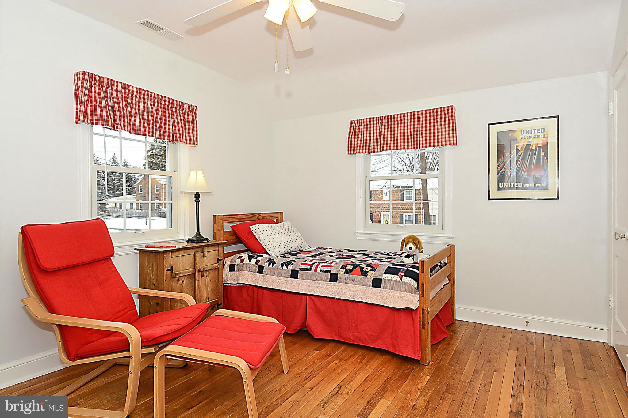 10504 Amherst Avenue Silver Spring, MD 20902 - Photo 27 of 30 a bedroom with furniture and a window