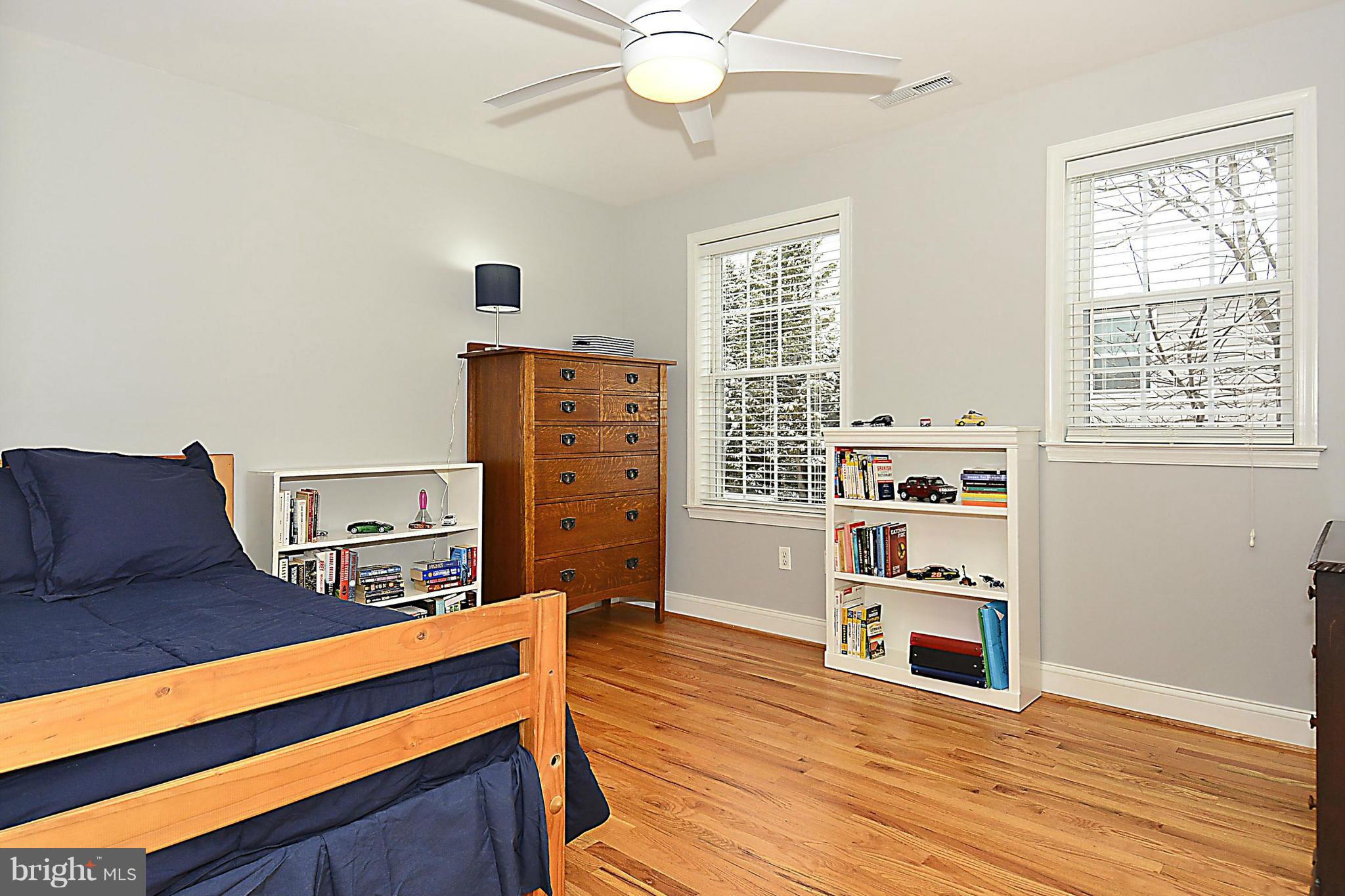 10504 Amherst Avenue Silver Spring, MD 20902 - Photo 28 of 30 a living room with furniture and a bookshelf