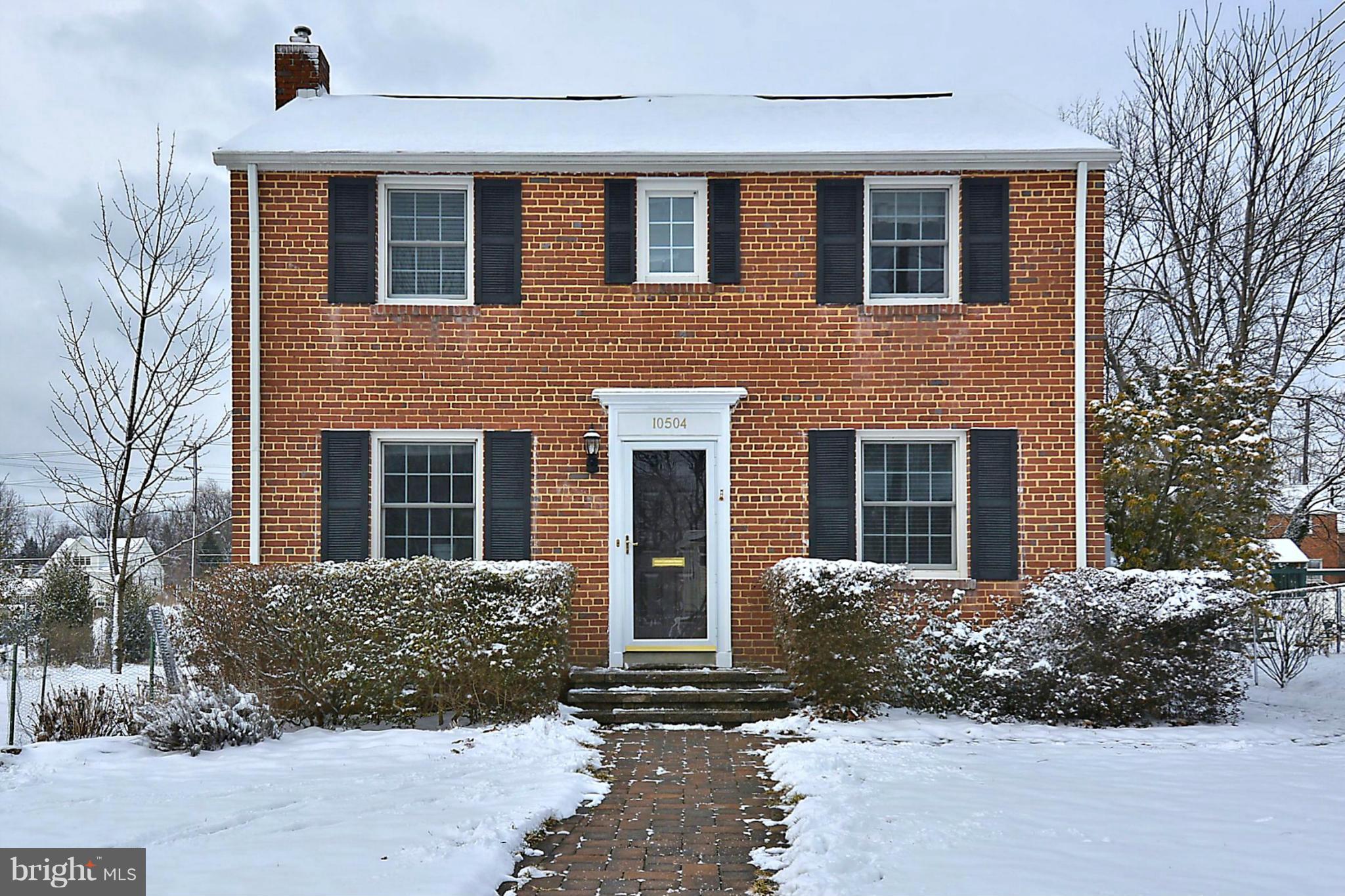 10504 Amherst Avenue Silver Spring, MD 20902 - Photo 4 of 30 front view of a brick house with a yard