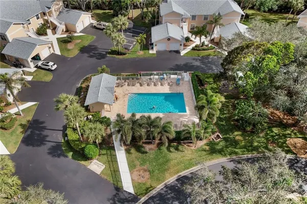 an aerial view of a house with a lake view