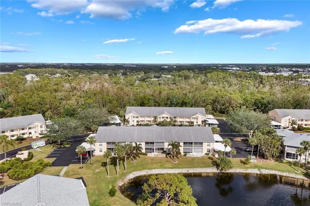 a green field with some trees in the background
