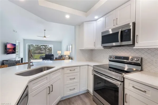 $387,000 | 774 Wiggins Lake Drive, Unit 203, Naples, FL 34110