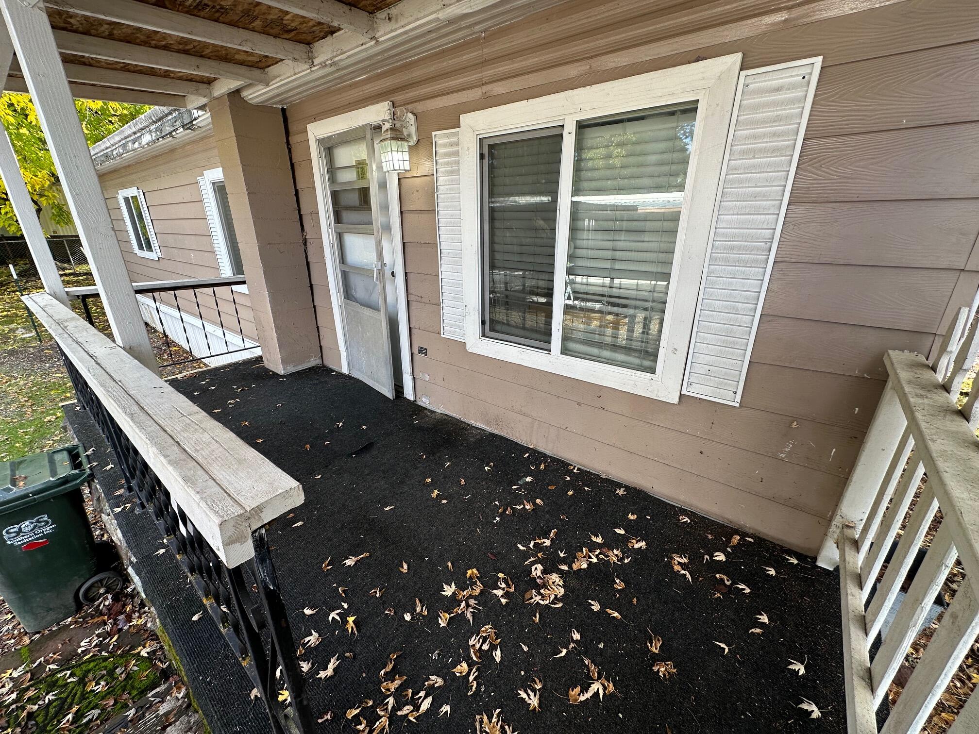 421 Stevens Road, Unit 52 Eagle Point, OR 97524 - Photo 3 of 18 a view of balcony and wooden floor