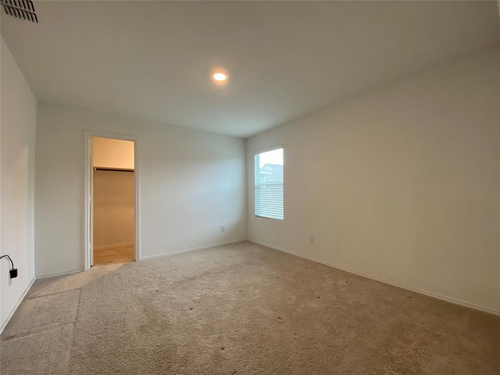 5911 Nyquist Way Forney, TX 75126 - Photo 19 of 38 a view of an empty room with a window
