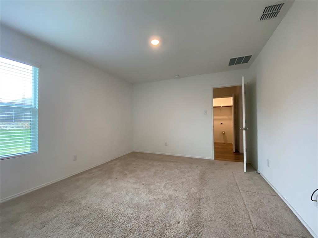 5911 Nyquist Way Forney, TX 75126 - Photo 22 of 38 an empty room with windows