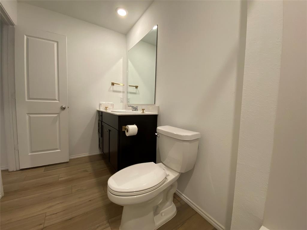 5911 Nyquist Way Forney, TX 75126 - Photo 29 of 38 a bathroom with a toilet and a sink