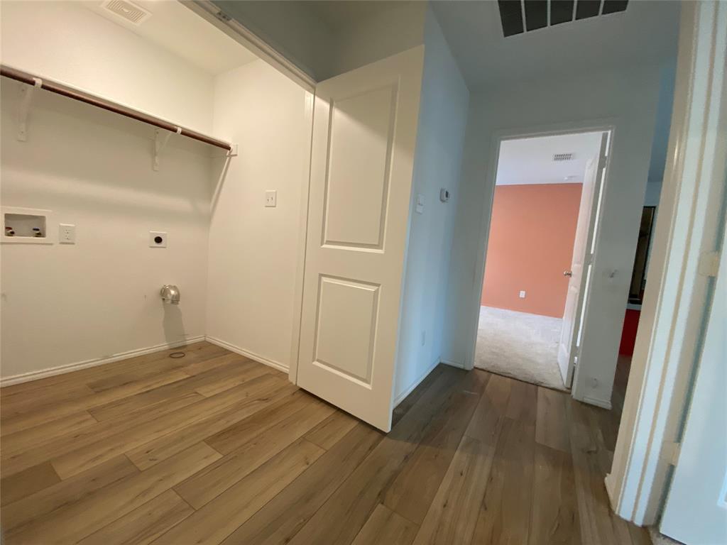 5911 Nyquist Way Forney, TX 75126 - Photo 31 of 38 a view of a hallway with wooden floor