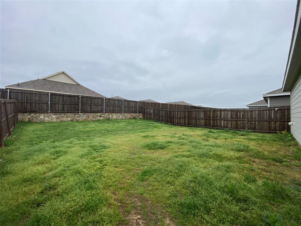 5911 Nyquist Way Forney, TX 75126 - Photo 33 of 38 a view of a backyard with a garden