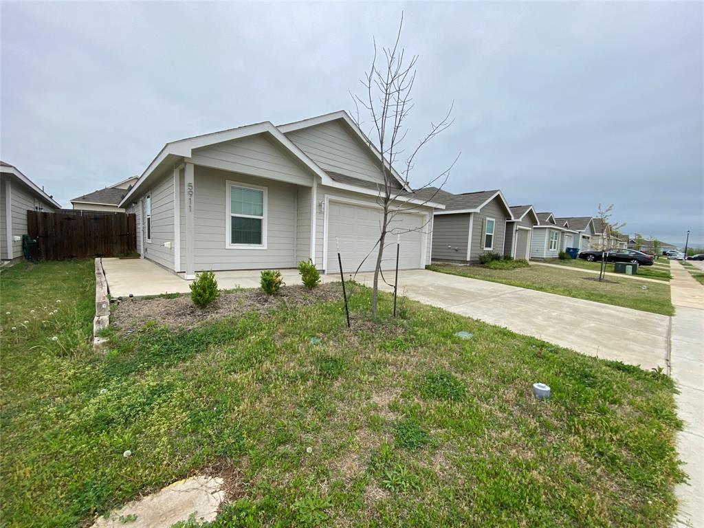 5911 Nyquist Way Forney, TX 75126 - Photo 6 of 38 a front view of a house with garden
