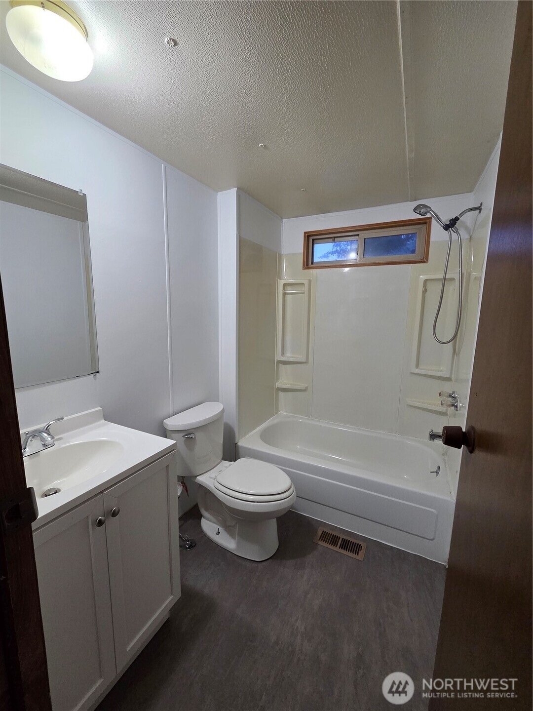 10531 176th Avenue Southwest, Unit 6 Rochester, WA 98579 - Photo 14 of 24 a bathroom with a sink a toilet and shower