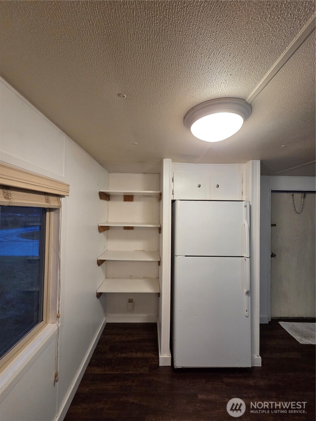 10531 176th Avenue Southwest, Unit 6 Rochester, WA 98579 - Photo 16 of 24 a white refrigerator freezer and a stove sitting inside of a kitchen