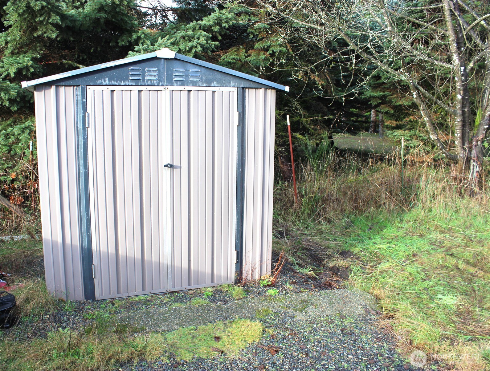 10531 176th Avenue Southwest, Unit 6 Rochester, WA 98579 - Photo 18 of 24 a view of a backyard of the house