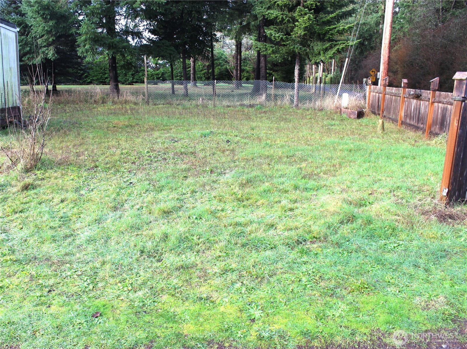 10531 176th Avenue Southwest, Unit 6 Rochester, WA 98579 - Photo 21 of 24 a view of outdoor space with deck and trees