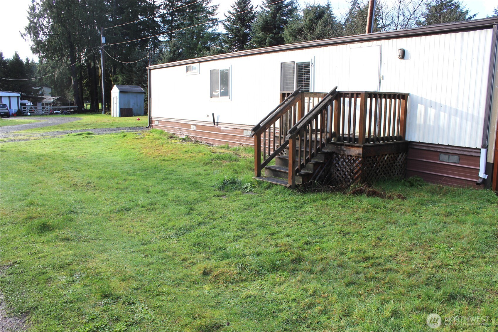 10531 176th Avenue Southwest, Unit 6 Rochester, WA 98579 - Photo 22 of 24 a view of a backyard with wooden fence