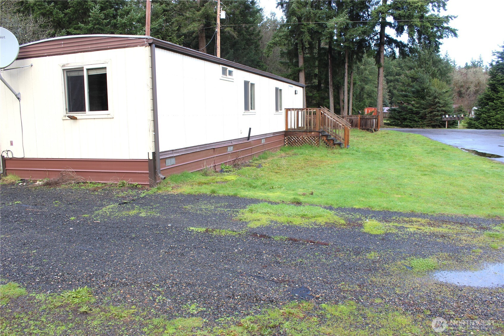 10531 176th Avenue Southwest, Unit 6 Rochester, WA 98579 - Photo 4 of 24 a view of a house with backyard