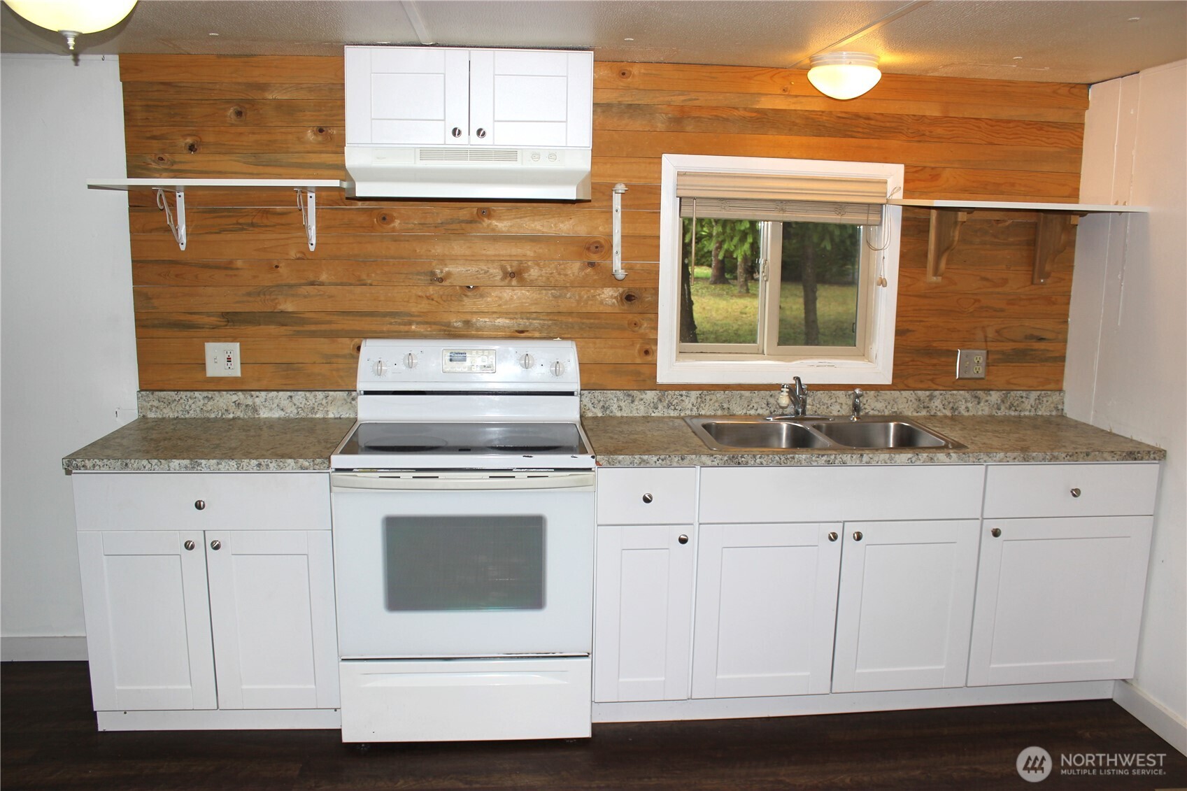10531 176th Avenue Southwest, Unit 6 Rochester, WA 98579 - Photo 8 of 24 a kitchen with granite countertop white cabinets and white appliances