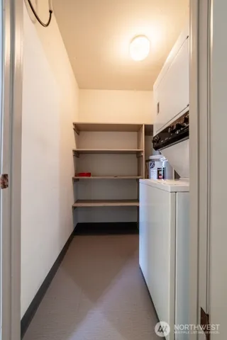 swimming pool view with a seating space