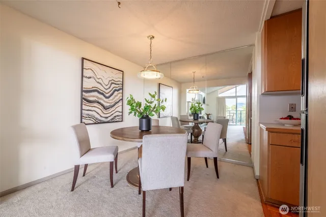 a kitchen with sink a refrigerator and wooden floor