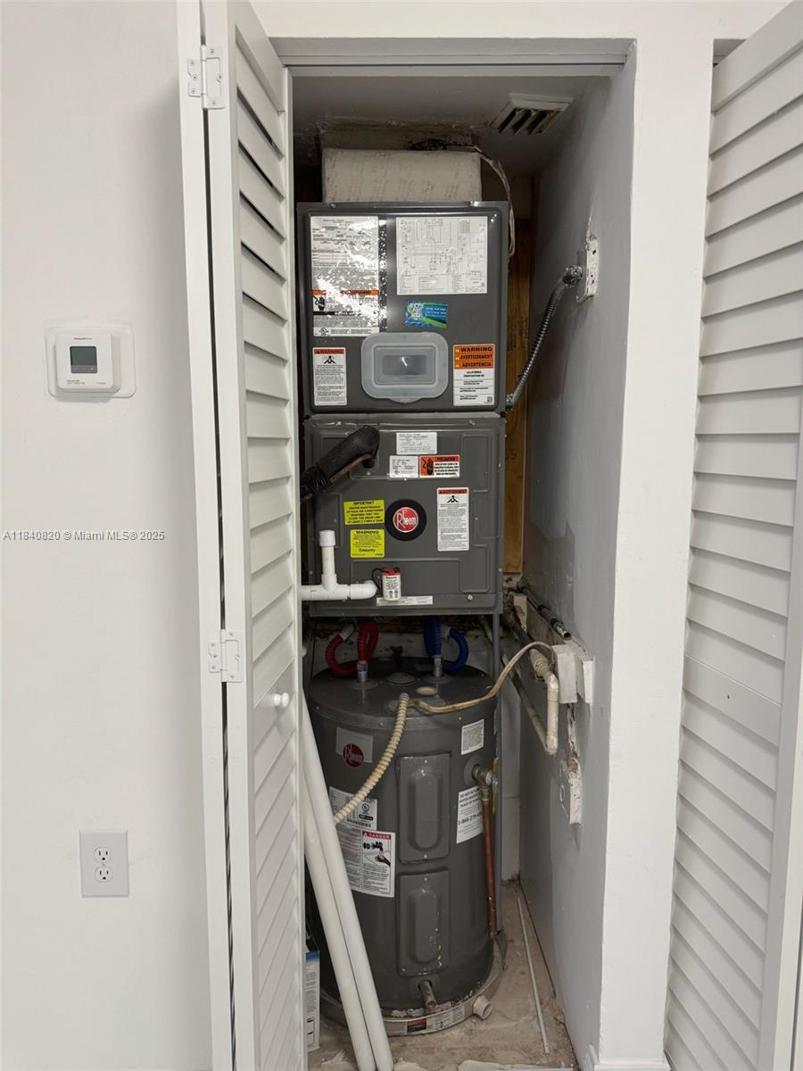 7010 Northwest 179th Street, Unit 105 Hialeah, FL 33015 - Photo 9 of 9 a utility room with dryer and washer