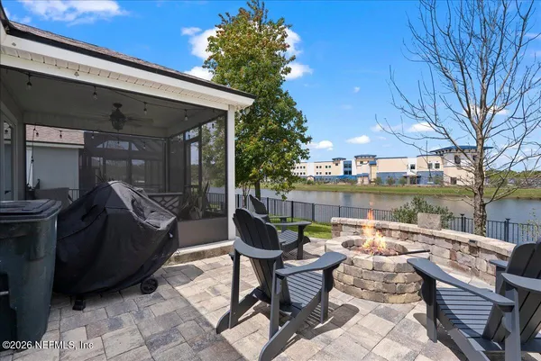 a view of a patio with chair and tables