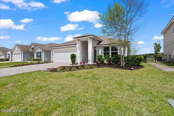 a front view of house with yard and green space