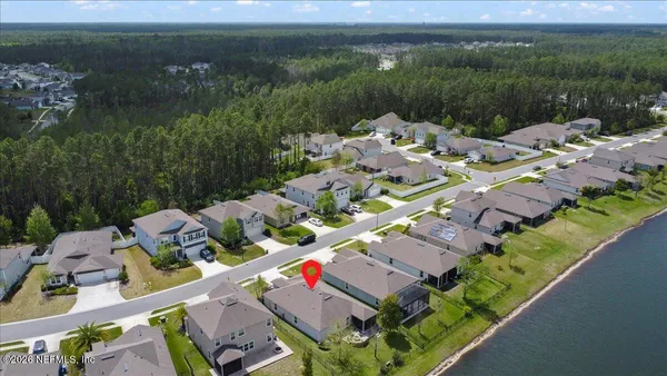 a aerial view of a house with a lake view