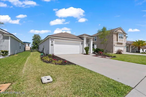 a front view of a house with yard