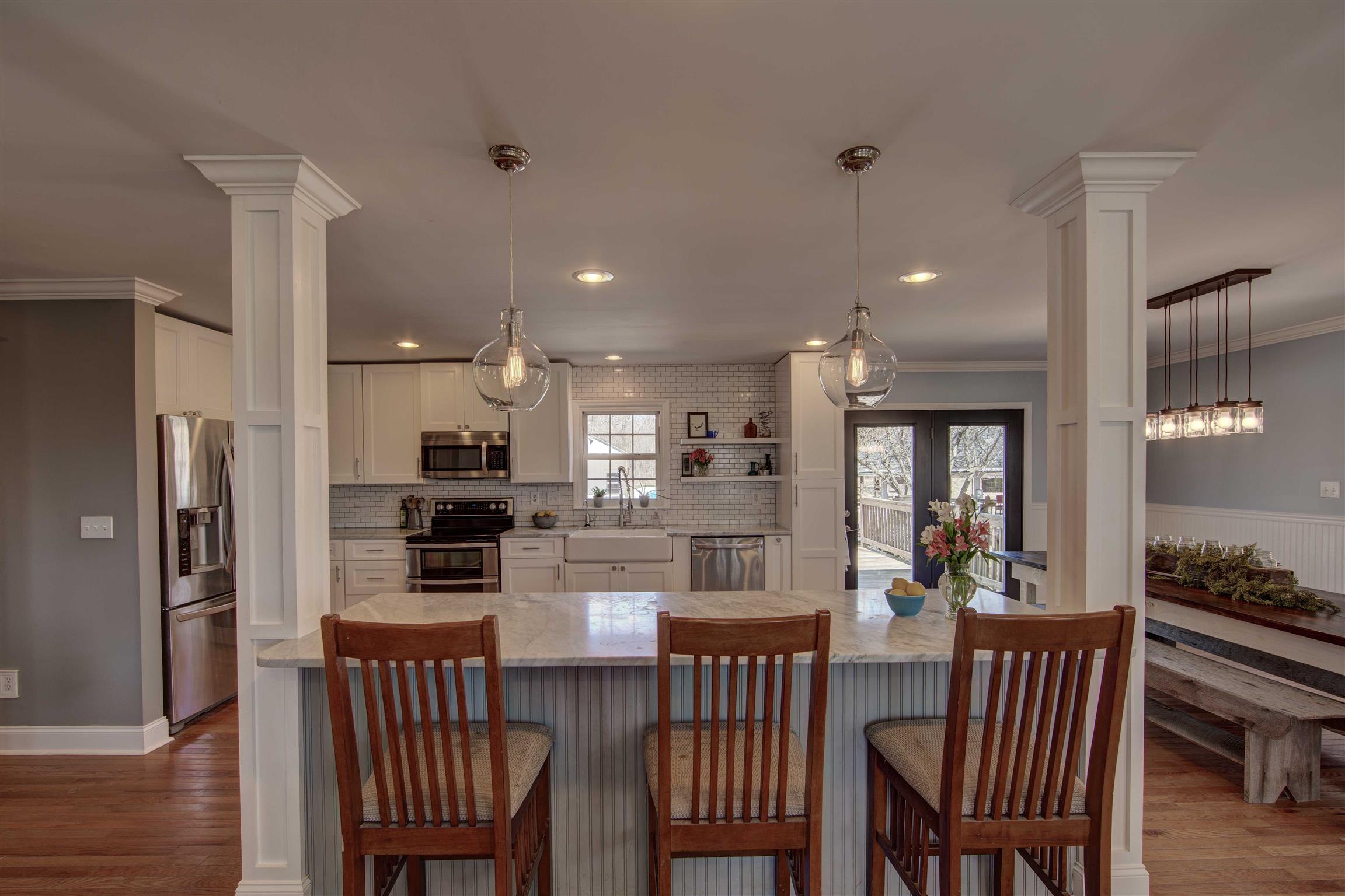 700 Baker Road Columbia, TN 38401 - Photo 11 of 30 a kitchen with a dining table chairs and refrigerator