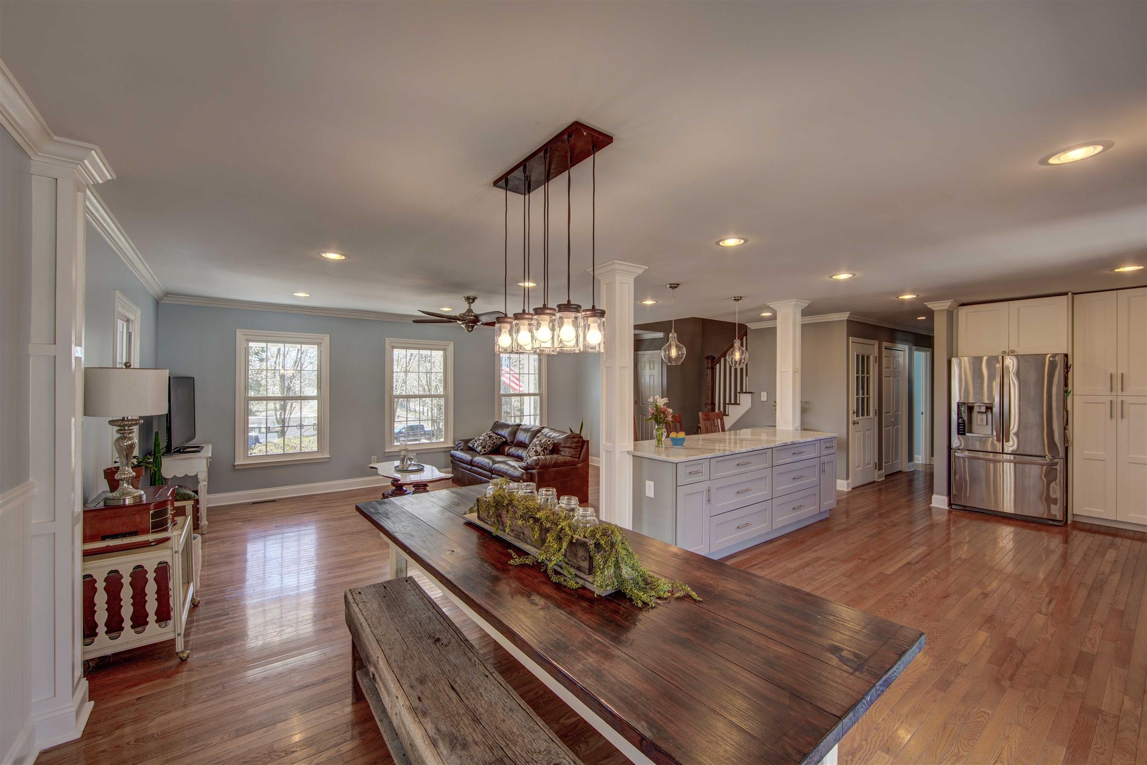 700 Baker Road Columbia, TN 38401 - Photo 30 of 30 a large living room with stainless steel appliances furniture or kitchen view and a wooden floor