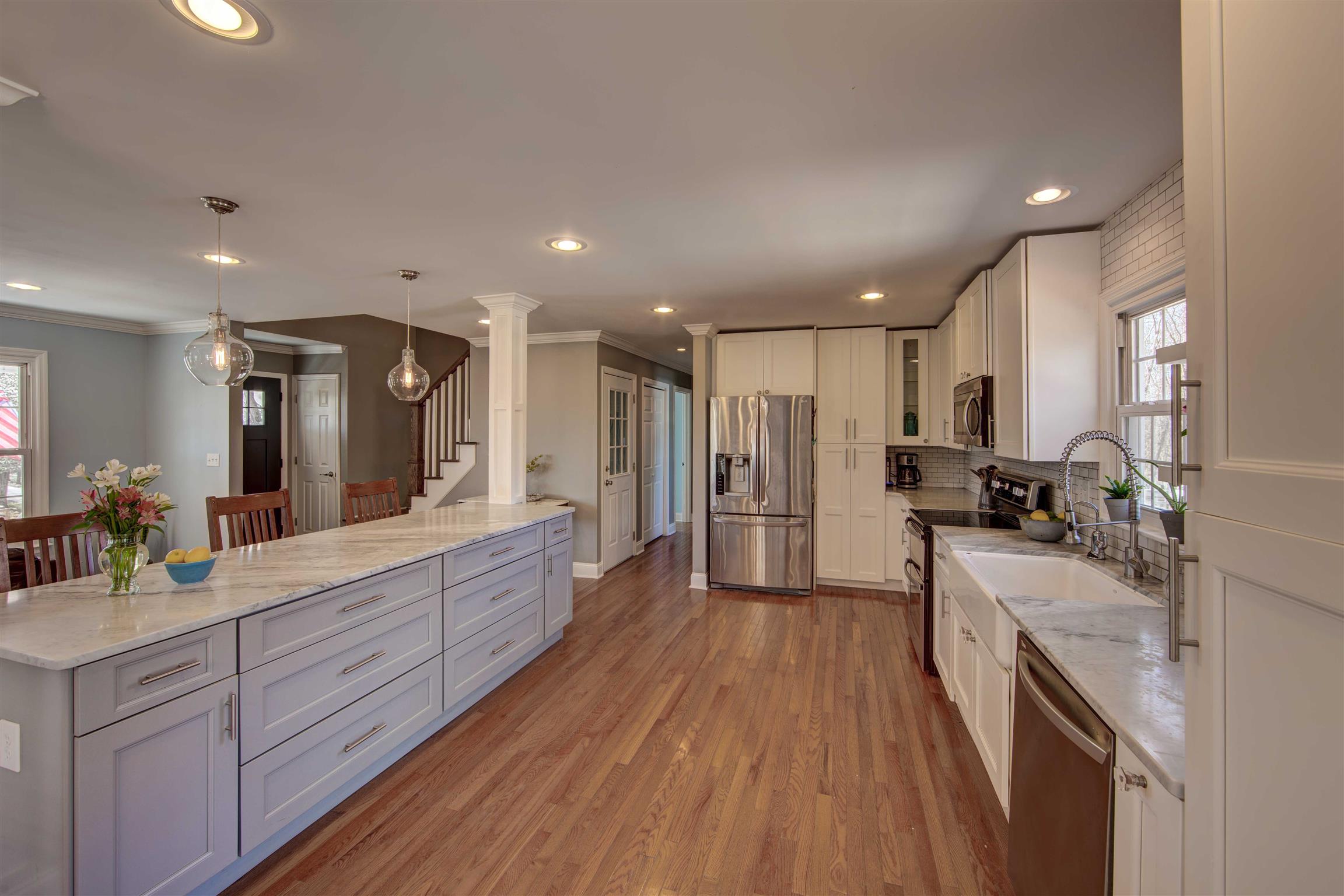 700 Baker Road Columbia, TN 38401 - Photo 15 of 30 a large kitchen with stainless steel appliances lots of counter space and wooden floor