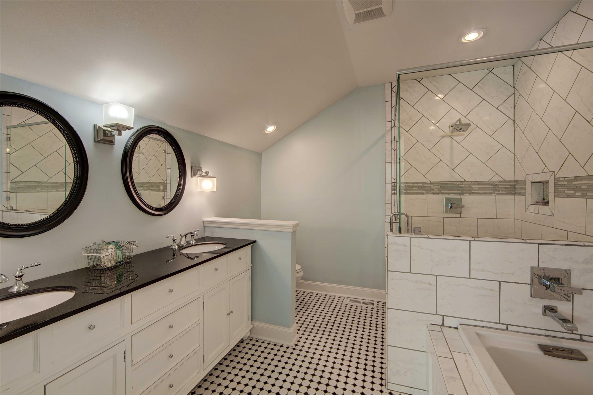 700 Baker Road Columbia, TN 38401 - Photo 18 of 30 a bathroom with a double vanity sink and a mirror